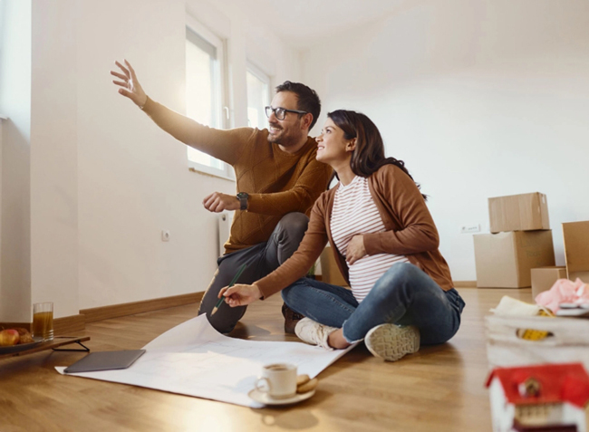 Excited couple planning their dream home at Catena Estate in Anketell, a thriving community offering modern, stylish living for families and professionals