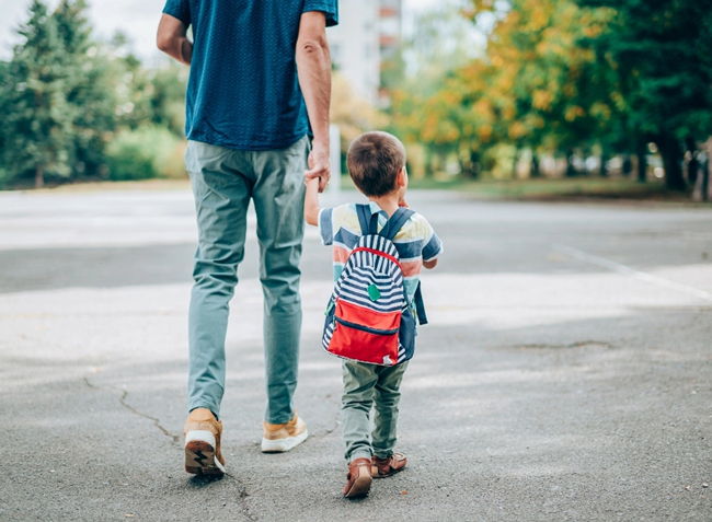 Father and child walking hand in hand to school in Anketell’s Catena Estate, a vibrant community designed for families with education and lifestyle in mind